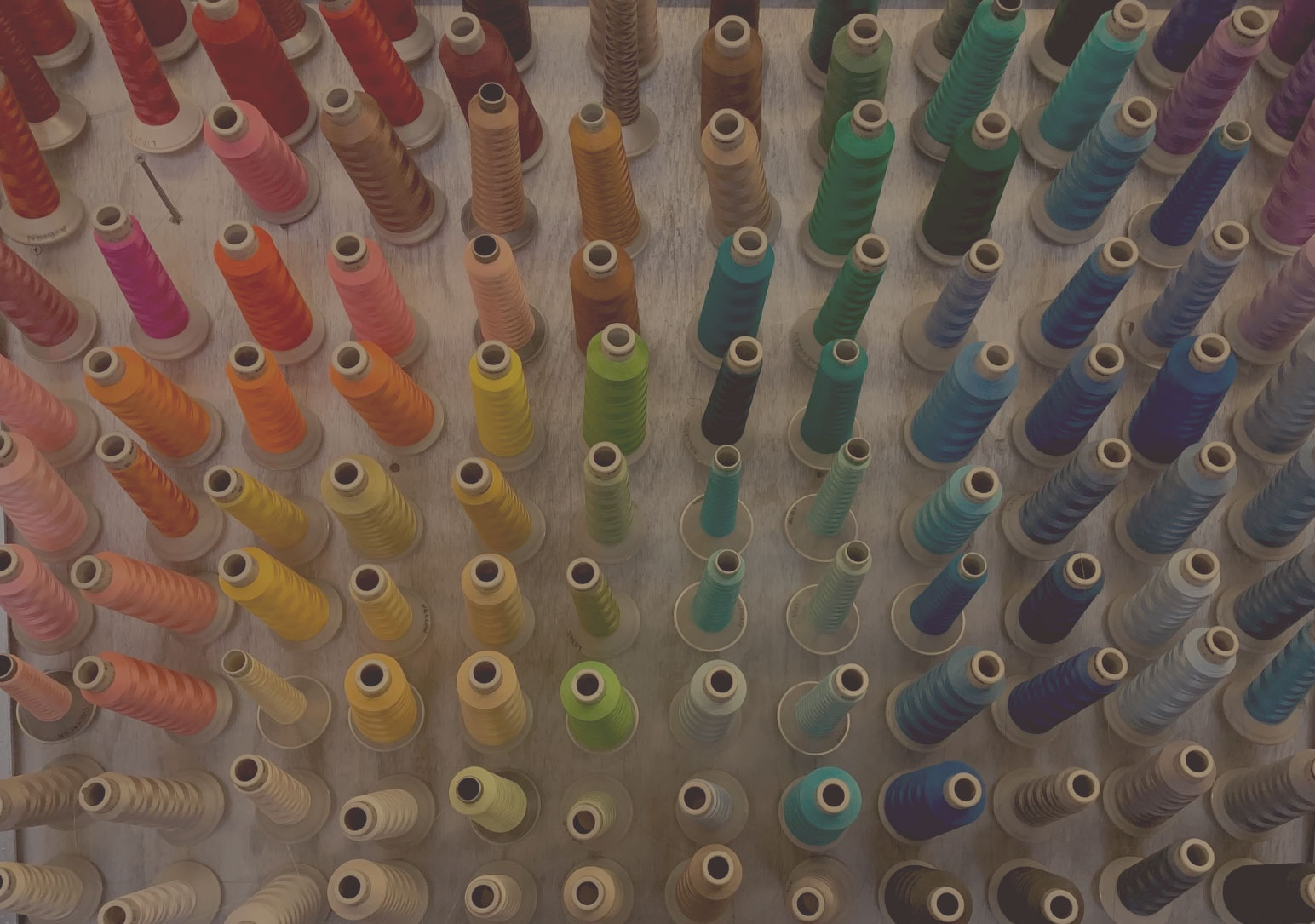 Rows of colorful embroidery thread at Creative Stitches